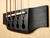 Keyhole-shaped slots help anchor the ball ends of the strings